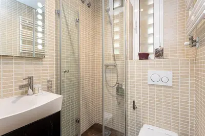 a bathroom with a shower and a sink and a toilet at Canela Homes BARCELONA OLYMPIC in Barcelona