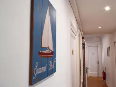 a painting of a sailboat on a wall at Blue Barcelona in Barcelona