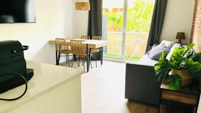 a kitchen and dining room with a table and chairs at Centro con terraza blco by Prestigi in Terrassa