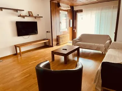 a living room with a couch and a table at Sant Guillem in Vilassar de Mar