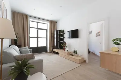 a living room with a couch and a table at Sagrada Familia Apartment in Barcelona