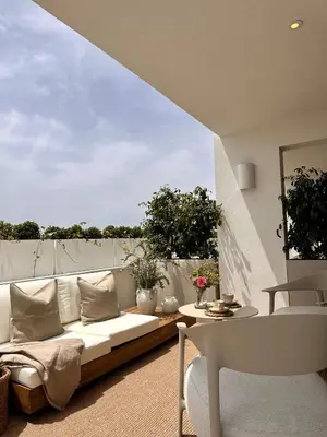 a living room with a couch and a table at Apartamentos Azul in Castelldefels
