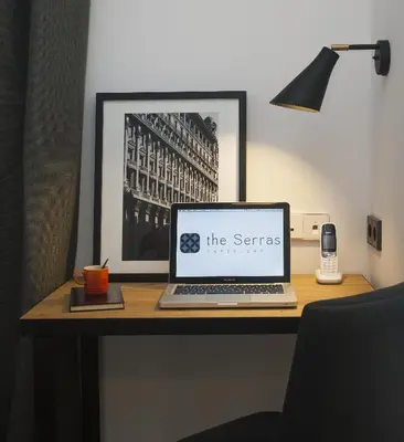 a laptop computer sitting on top of a desk at Serras Barcelona in Barcelona