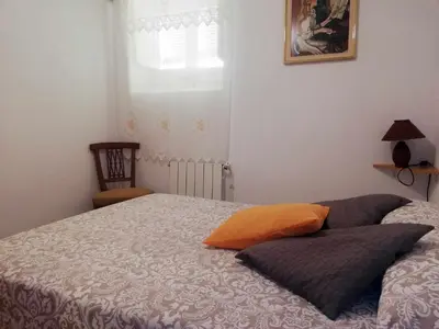 a bedroom with a bed with two pillows on it at Joanet Guarda turismo familiar en plena naturaleza in La Guardiola