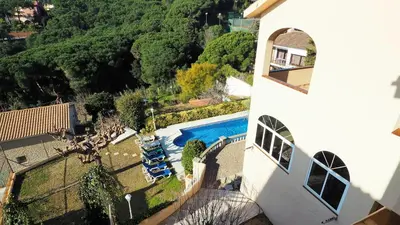 an aerial view of a house with a swimming pool at Villa Antonia in Mataró