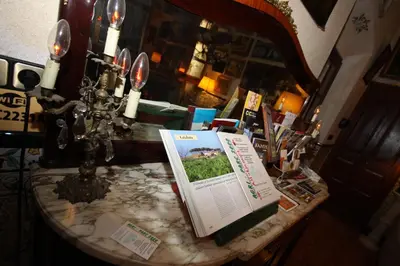 a table with a menu on it in a restaurant at El Recer in Sant Pau dʼOrdal