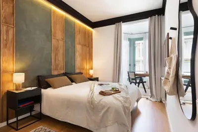 a room with a hallway with a black bag on the wall at Bantu - 1 bedroom and balcony in Eixample Esquerra in Barcelona