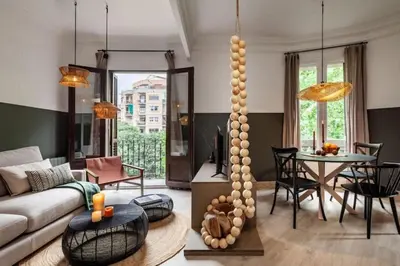 a living room with a couch and a table at Vili - 2 bedrooms and balcony in Sant Antoni in Barcelona