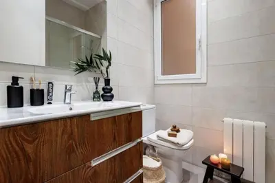 a plant sitting on a table next to a couch at Vili - 2 bedrooms and balcony in Sant Antoni in Barcelona