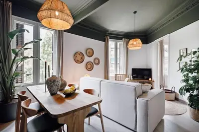 a room with a window and a basket on the floor at Bari - 2 bedroom and office in Sant Antoni in Barcelona