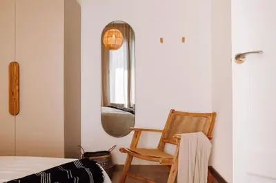 a bedroom with a large bed and a window at Bari - 2 bedroom and office in Sant Antoni in Barcelona