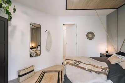 a bedroom with a bed and a desk and a window at Tagbu - 2 bedroom and balcony in Eixample Dreta in Barcelona
