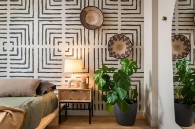 a patio with two hammocks hanging from a wall at Lulua - 2 bedrooms in Eixample Dreta in Barcelona