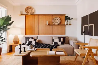 a living room with a couch and a table at Yulu - 3 bedrooms and balcony in Eixample Dreta in Barcelona