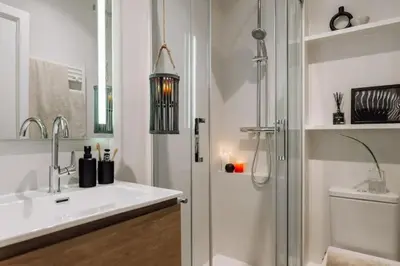 a room with a room with a bed and a wall at Songe - 2 bedroom in Eixample Esquerra in Barcelona