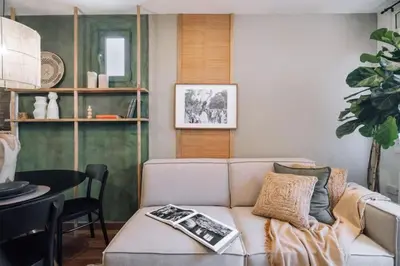 a kitchen with white cabinets and a counter top at Bolia - 2 bedrooms in Eixample Esquerra in Barcelona