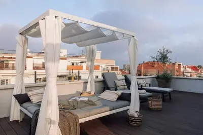 a room with a table and a mirror on the wall at Baka - 2 bedroom with terrace in Sant Gervasi in Barcelona