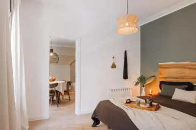 a white bathroom with a toilet and a sink at Baka - 2 bedroom with terrace in Sant Gervasi in Barcelona