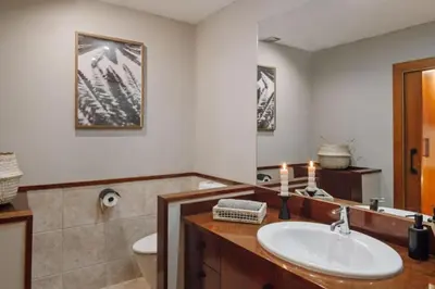 a dining room with a table and shelves with baskets at Babinga - 3 bedroom and balcony in Eixample Esquerra in Barcelona