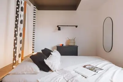 a living room with a table and a couch at Babinga - 3 bedroom and balcony in Eixample Esquerra in Barcelona