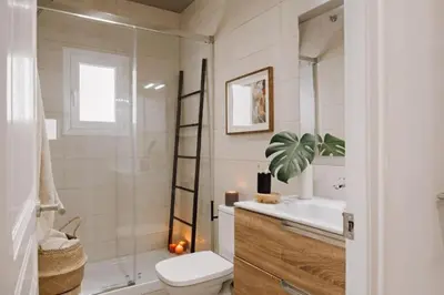 a hallway leading to a living room with a table at Hemba - 3 bedroom and balcony in Gracia in Barcelona