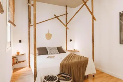 a bedroom with a large bed in a room at Sanga - 2 bedroom in Eixample Esquerra in Barcelona