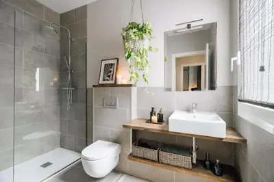 a kitchen with white cabinets and two pendant lights at Salonga - 1 bedroom and balcony in Eixample Esquerra in Barcelona