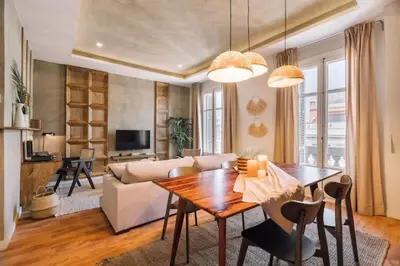 a room with a shelf with plants and a candle at Salonga - 1 bedroom and balcony in Eixample Esquerra in Barcelona