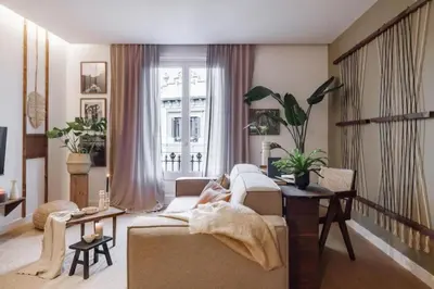 a table with a potted plant on top of it at Bemba - 1 bedroom and swimming pool in Passeig de Gracia in Barcelona