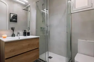 a bathroom with two sinks and a shower at Mwitu - 2 bedroom and balcony in Poblenou in Barcelona