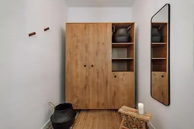 a room with a wooden door and a mirror at Mwitu - 2 bedroom and balcony in Poblenou in Barcelona