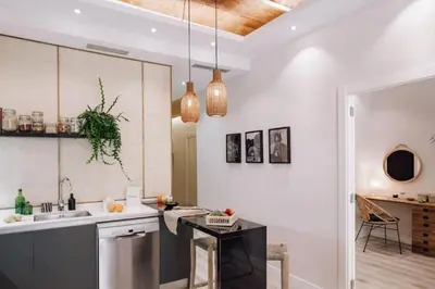 a bedroom with a bed and two potted plants at Zongo - 2 bedroom in Eixample Dreta in Barcelona