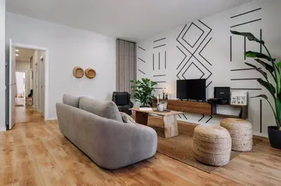 a bedroom with a large bed with a table on it at Luiza - 3 bedroom in Eixample Dreta in Barcelona