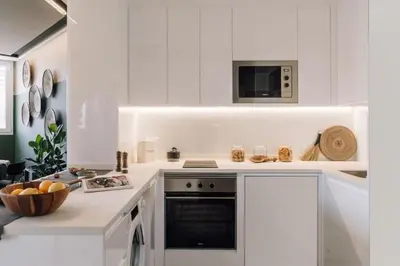 a dining room with plates on the wall at Batwa - 1 bedroom in Passeig de Gracia in Barcelona
