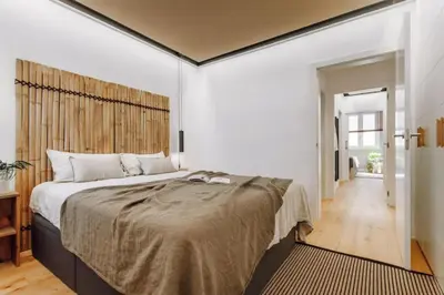 a dining room with a table and chairs at Lega - 2 bedroom in Passeig de Gracia in Barcelona