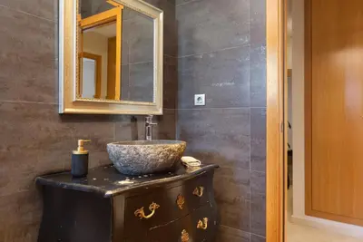 a bathroom with a sink and a mirror at Villa Beach Barcelona in Montgat