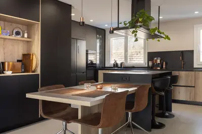 a kitchen with a table and some chairs at Villa Beach Barcelona in Montgat