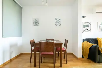 a dining room with a table and chairs at Relax In A Chic Apartment In Sants in Barcelona