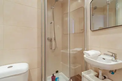 a bathroom with a shower and a sink and a toilet at Amazing Terrace In Sant Andreu in Barcelona