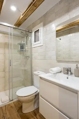 a bathroom with a toilet and a shower and a sink at Cozy Studio In Ciutat Vella in Barcelona