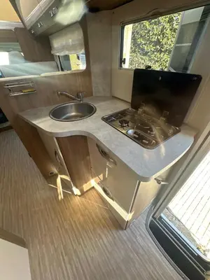 a kitchen in an rv with a sink at Rent&Road in Caldes de Montbui
