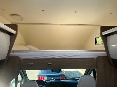 a room with a bed in the back of a van at Rent&Road in Caldes de Montbui