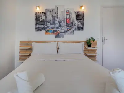 a bedroom with a large white bed in a room at Arlene apartment by Hello Homes Sitges in Sitges