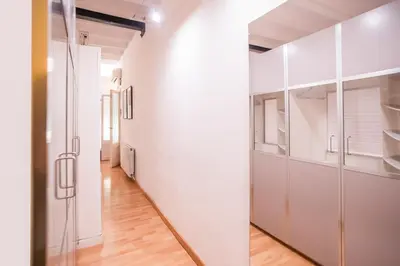 a room with white cabinets and a hallway at EL BORN - Barcelona - Port 5 pax 2 bedrooms in Barcelona