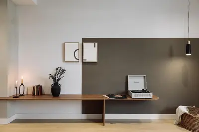 a living room with a couch and a tv at Aiguablava - 1 bedroom and pool in Pedralbes in Barcelona