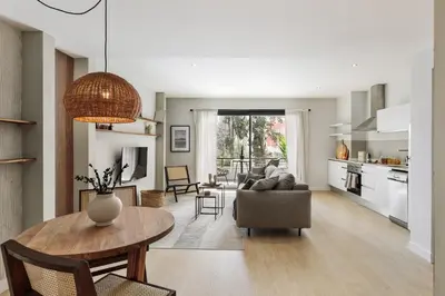 a desk with a chair and a lamp and a book at Aiguablava - 1 bedroom and pool in Pedralbes in Barcelona