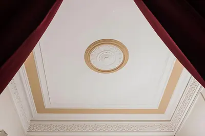 a coffered ceiling with a clock on it at Fashion House in Barcelona