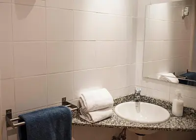 a bathroom with a sink and a mirror at Fashion House in Barcelona