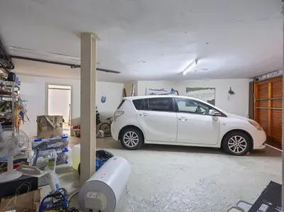 a white car is parked in a garage at Villa Marítima in Pineda de Mar in Pineda de Mar