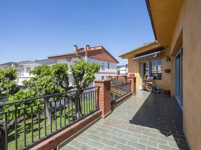 a balcony of a house with a fence at Villa Marítima in Pineda de Mar in Pineda de Mar